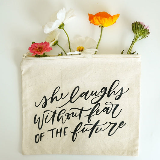 She Laughs Without Fear Of The Future Pouch Bag